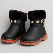 Cozy black winter boots with plush fur lining, pearl-studded strap, and golden.