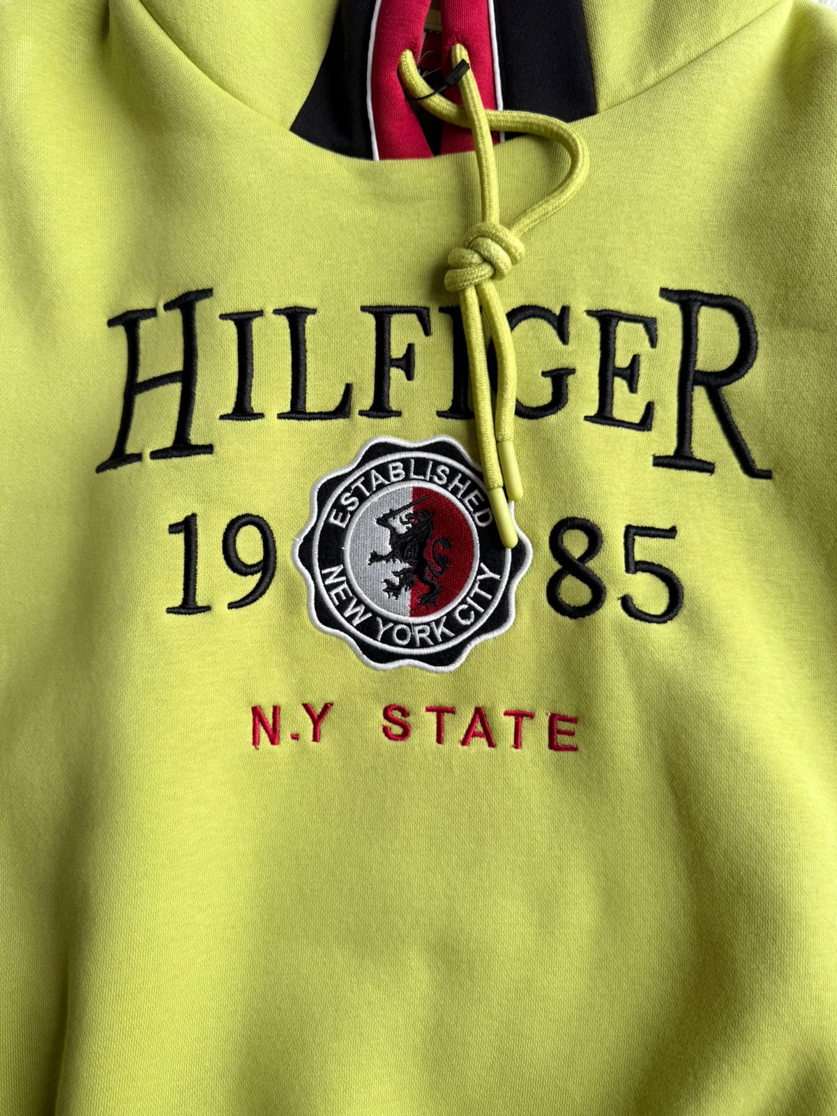 Vibrant Hilfiger 1985 hoodie with bold red and black stripe detailing for a sporty, stylish look.