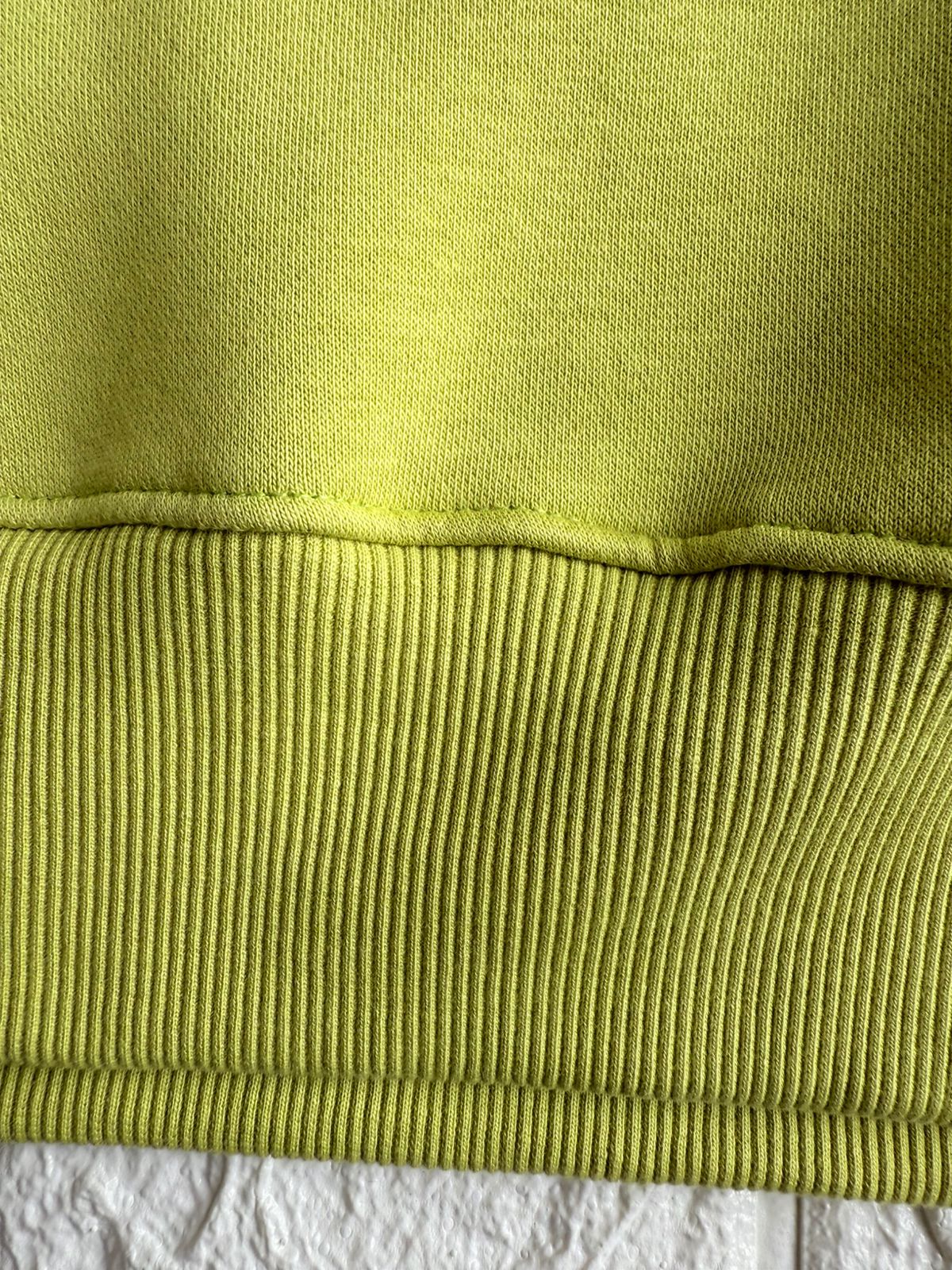 Vibrant Hilfiger 1985 hoodie with bold red and black stripe detailing for a sporty, stylish look.